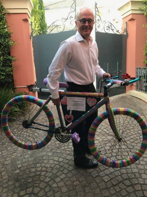 The rainbow crocheted Love Wheels bicycle which was chained to a pole outside Prime Minister Malcolm Turnbull's Sydney home during the marriage equality postal vote campaign will join the National Museum of Australia's collection in Canberra. Photo: Supplied