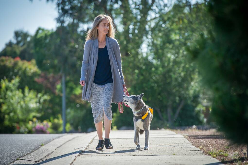 Stirling dog attack victim Livia Auer, pictured with her assistance dog Peppa, is disappointed that the dog owners are claiming diplomatic immunity. Photo: Karleen Minney