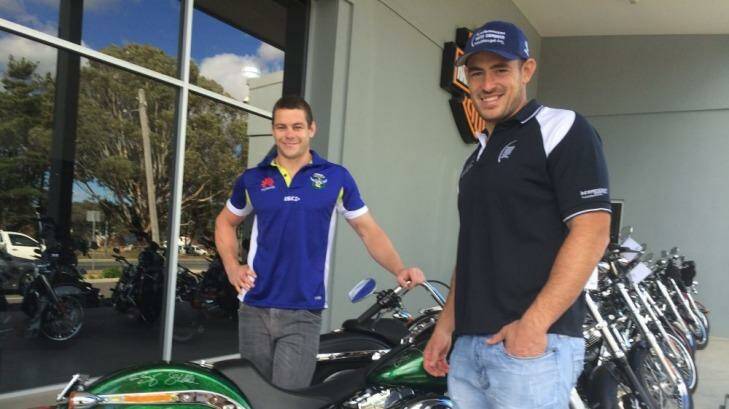 Canberra Raiders stars Shaun Fensom and Terry Campese with the bike raffled off to raise money for the Terry Campese Foundation.