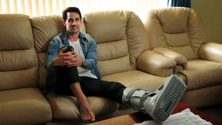 Carl Valeri relaxes in his Canberra home after having ankle surgery. Photo: Colleen Petch