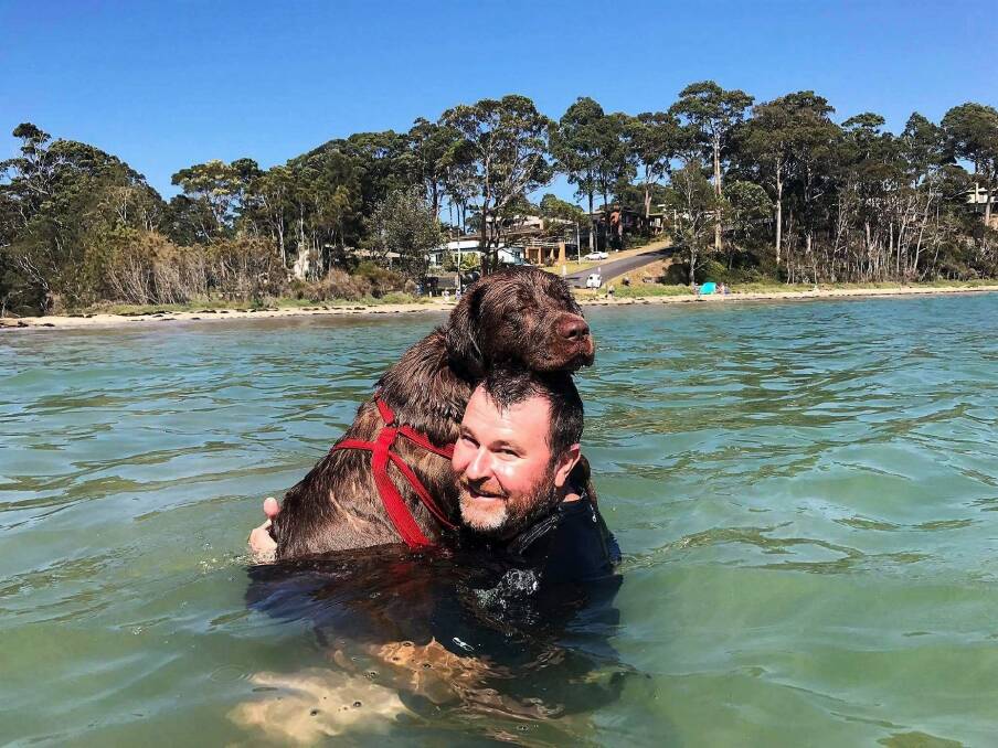 Gus the dog and Michael Birchall at Wimbie Beach as taken by Michael's daughter Katelyn. The shot won the people's choice award in the The Canberra Times Me and My Pet photo competition. Photo: Katelyn Birchall