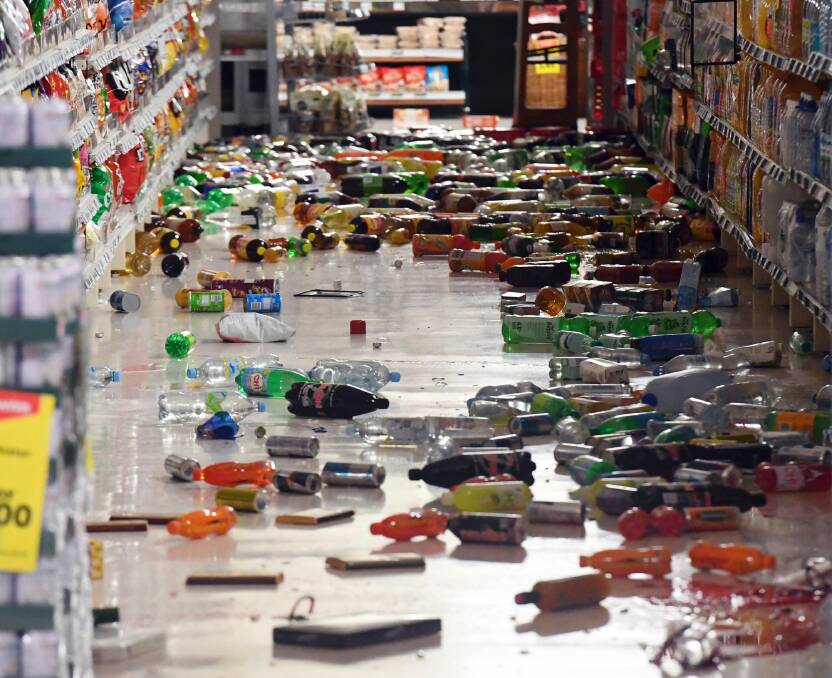 Groceries litter the aisle of a Wellington supermarket on Monday after a major earthquake struck New Zealand's south Island. Photo: AP/Ross Setford