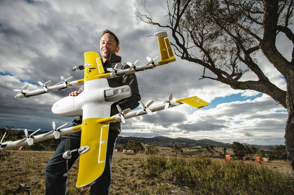 Wing chief executive James Ryan Burgess with one of the delivery drones.  Photo: Sitthixay Ditthavong