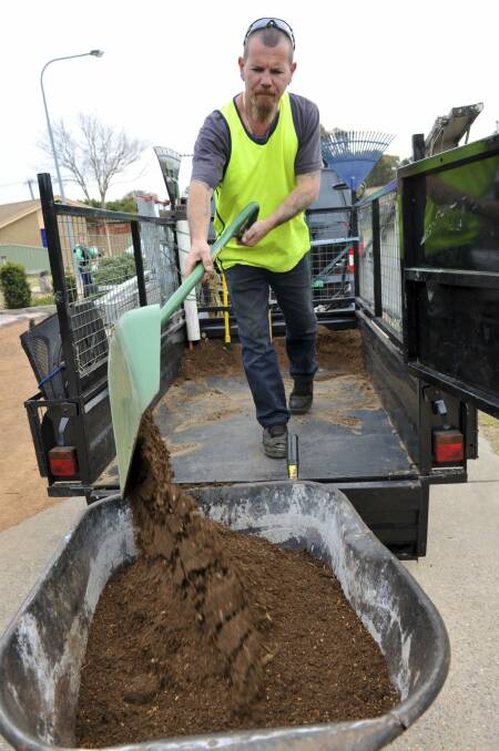 Troy Sanderson, of Chisholm, who operates landscaping business Man Van Mower, pictured on the job. 
 Photo: Graham Tidy