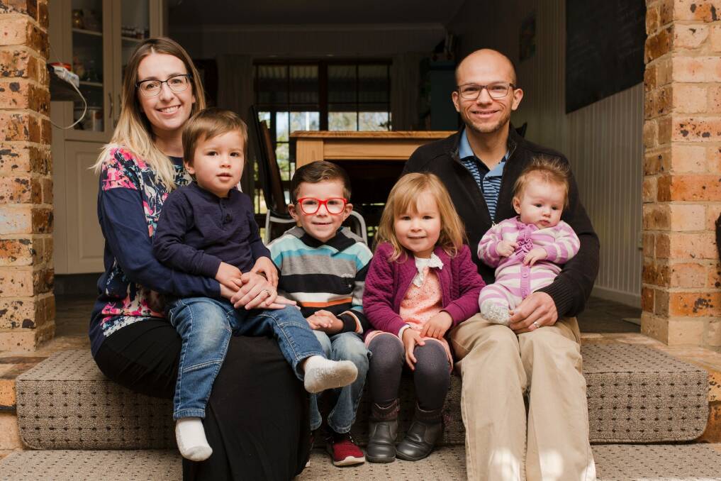 Mistin Arambula recently gave birth to her fourth child at home as part of the ACT government trial. Mistin and Juan with their children Caleb, 2, Gabriel, 5, Eden, 3, and Adelynn Rose Joy 3-months. Photo: Jamila Toderas