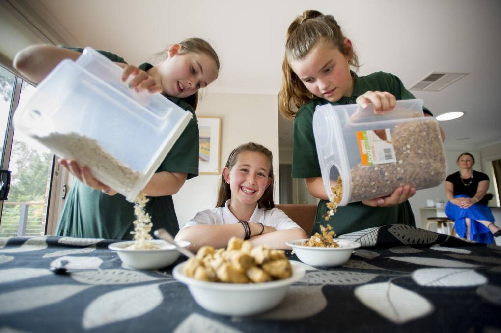 
Mother Fiona Loaney with daughter (middle) Emma, 10, and friends Elissa Gallop, 10 and Zoe Sherrad, 10, avoid getting hangry by having breakfast. Photo: Jay Cronan