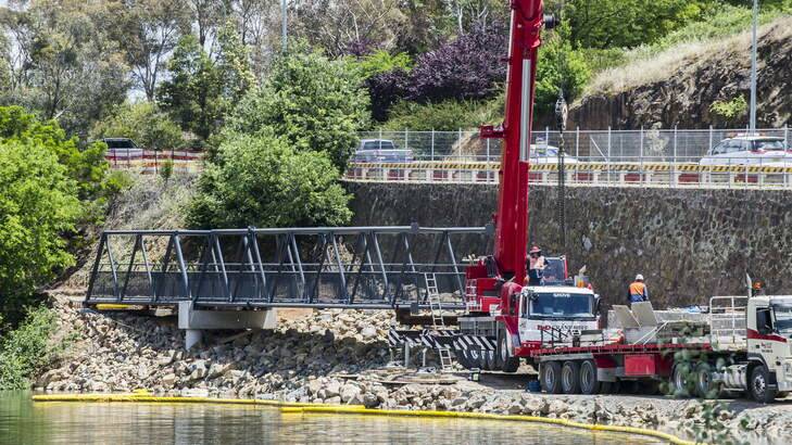 A bridge is being installed to replace the bike path washed away beside Morshead Drive. Photo: Rohan Thomson