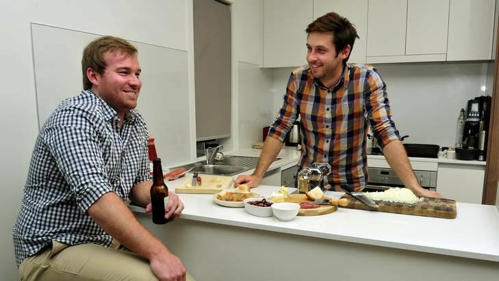 Jarrod Deaton, right, with his friend Jhie Hough - both moved from Leeton to Canberra 12 years ago. Photo: Melissa Adams