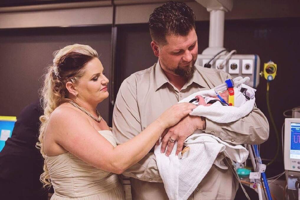 Macarthur couple Kylie and James Wiggins wanted to be close to their son Dolton on their special day so had  their wedding in the Neonatal Intensive Care Unit at the Canberra Hospital last year. Photo: Genevieve Dahl Photograpy