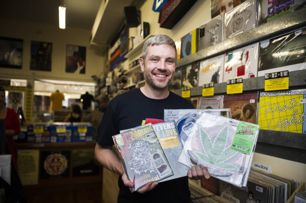 Landspeed Records owner Blake Budak holds some of the limited release records his store will have on sale for Record Store Day on Saturday. Photo: Dion Georgopoulos