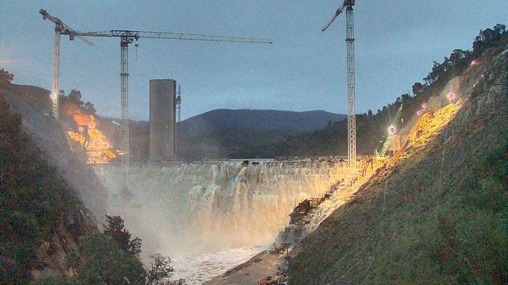 Rare spectacle ... Canberrans flocked to see Cotter Dam overflowing, from Brindabella Road or online at Actew's DamCam. Photo: Actew