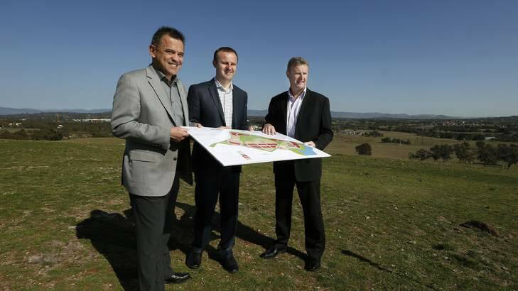 Chris Bourke MLA and Treasurer Andrew Barr MLA with Land Development Agency director of sales Clint Peters. Photo: Jeffrey Chan
