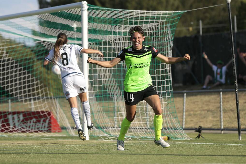 Canberra's Ashleigh Sykes celebrates after scoring against Melbourne Victory at McKellar Park last month, a match delayed an hour due to heat.  Photo: Jeffrey Chan