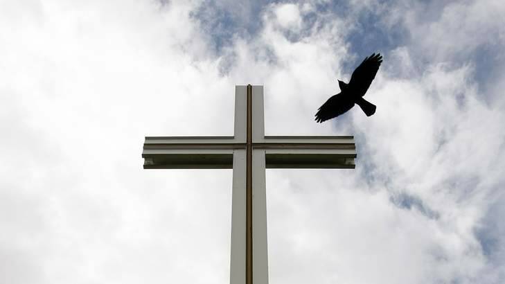 A crow flies past the Papal Cross in Phoenix Park, Dublin. Photo: Reuters