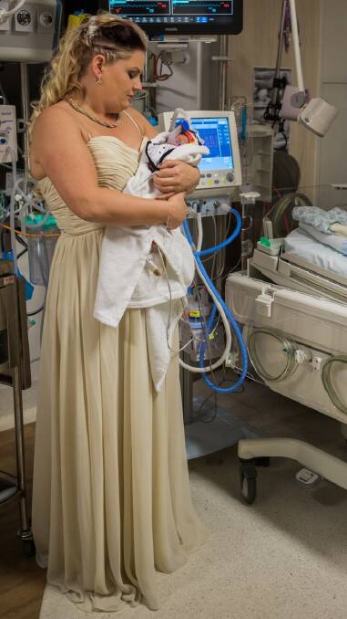 Kylie Wiggins of Macarthur with her baby son Dolton at her wedding in the Neonatal Intensive Care Unit at the Canberra Hospital. Photo: Genevieve Dahl Photography