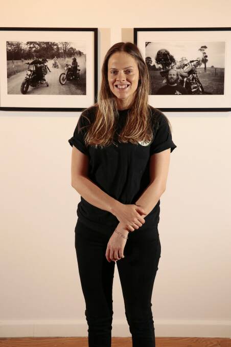 Canberra photographer Stella-Rae Zelnik with her exhibition, Smiles for Miles, at the M16 Artspace.  Photo: Jeffrey Chan