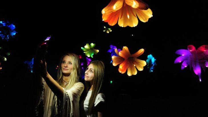 Commonwealth Park will come to life after dark for Floriade NightFest. Talia Liolios, left, of Chisholm, and Laura Mann, of Queanbeyan, in the Triffid Garden. Photo: Melissa Adams