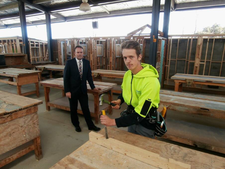 Quality matters: Master Builders Association ACT deputy executive director, Michael Hopkins, left, with first-year apprentice builder, Henry Pittar, from Belconnen. Henry says nothing is as satisfying as knowing that you have a done job to the best of your ability.  Photo: David Ellery