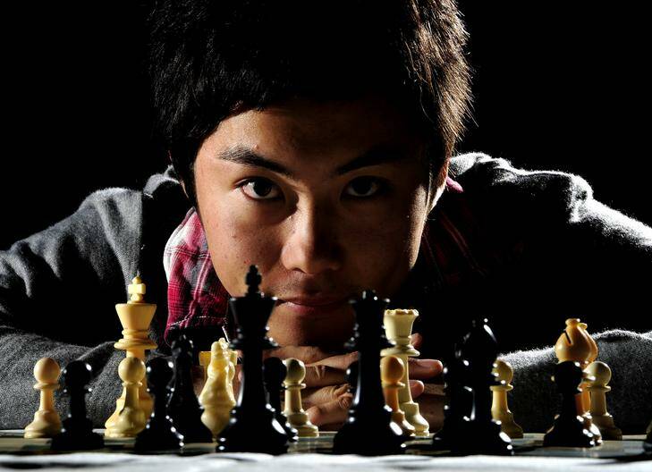 Canberra's Junta Ikeda takes part in the 50th Doeberl Cup chess tournament held at the Hellenic Club, Woden. Photo: Stuart Walmsley