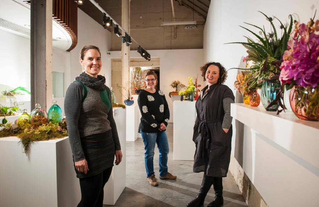Glass artist Harriet Schwarzrock with florists Pauline Moule, of Bloomin' Mad Flowers, and Narelle Phillips. Photo: Elesa Kurtz