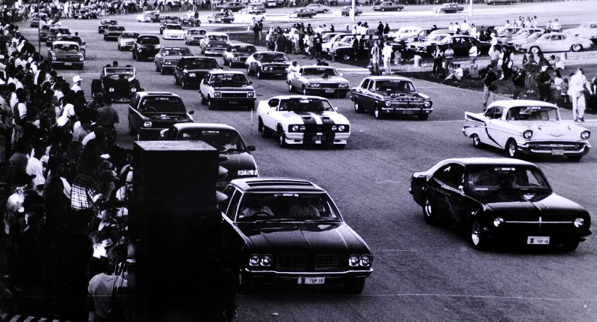 The stars of the show roll around the circuit in the Supercruise in Exhibition Park in December 1993. Photo: Canberra Times