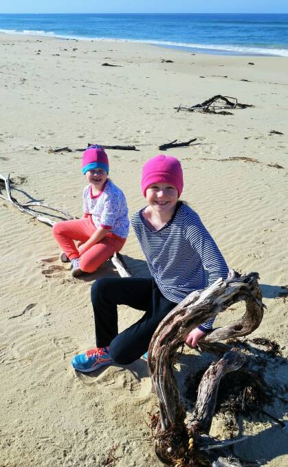 Augusta and Annabelle  Harrison on the beach where in Cape Conran Coastal Park where they recently witnessed algal bioluminescence. Photo: James Harrison