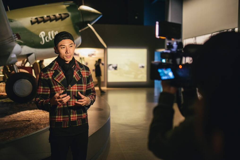 Singapore star Desmond Tan visiting the Australian War Memorial to record a travel show for screening in his homeland. Photo: Rohan Thomson