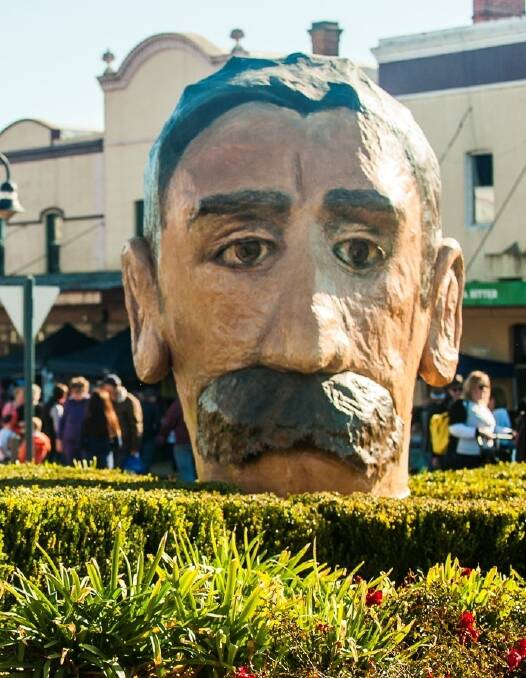 The giant papier mâché head of Henry Lawson on display in Grenfell. Photo: Supplied