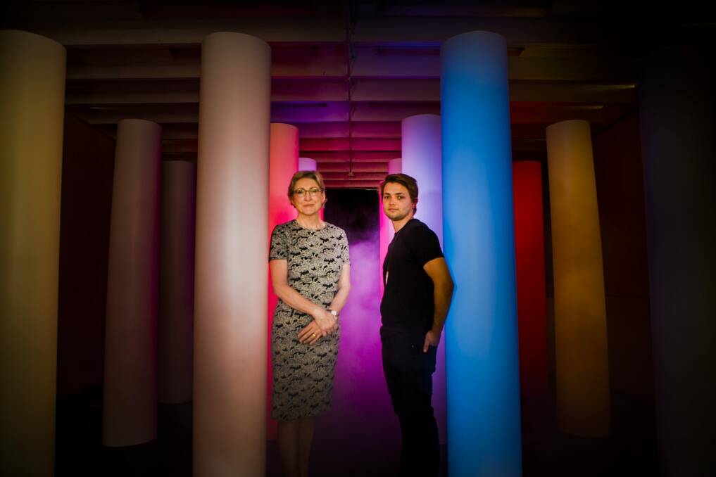 ANU School of Art head Denise Ferris, and graduating honours student Janis Lejins, with his work, <i>Doric Stacks</i>, which transposes real-time data flows into an immerse embodied experience of light, colour and sound. Photo: Jamila Toderas