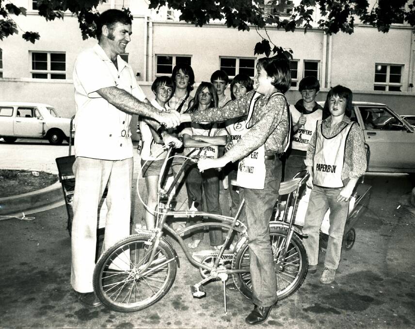 Presentation of a bike to the top paper boy at Johnstone's newsagents in Northbourne Ave City in 1974. Photo: Canberra Times