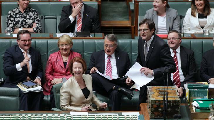 Prime Minister Julia Gillard reacts to Climate Change Minister Greg Combet's comments during Question Time. Photo: Alex Ellinghausen