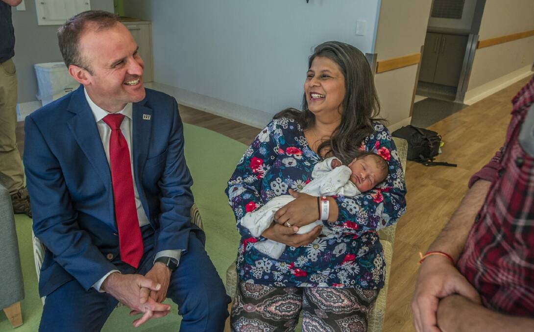 Chief Minister Andrew Barr campaigned at the Canberra Hospital campus on election day eve. He met newborn Rhianna Khanna and mum Meenal of Casey at the Canberra Women's and Children's hospital. Photo: Karleen Minney