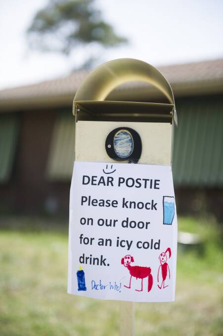 The Langford family have a sign on their letter box so posties know they can knock on the door to cool down. Photo: Dion Georgopoulos