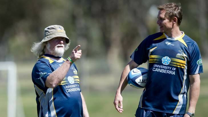 Laurie Fisher and Stephen Larkham  during Brumbies training. Photo: Jay Cronan