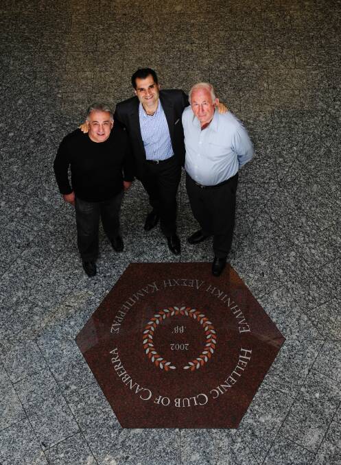 Centre, John Kalokerinos, president of the Hellenic Club in Woden, with foundation members from left, Michael George, a former president, and Alex Diamond.  Photo: Melissa Adams