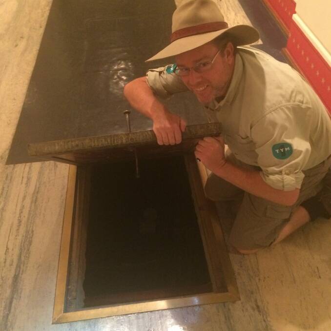 Tim the Yowie Man inspects a trap door at Old Parliament House.