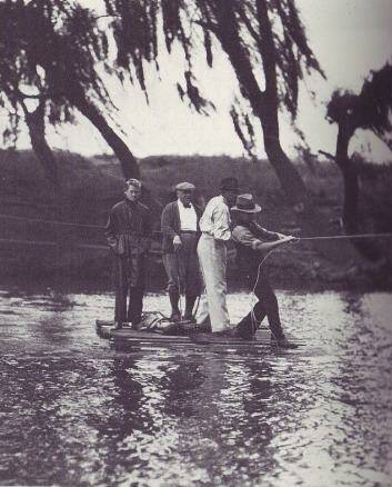 The game must go on: Crossing the Molonglo River on a pontoon to get to complete a round of golf at the original Royal Canberra Golf Club circa 1934. Photo: Canberra Royal Golf Club