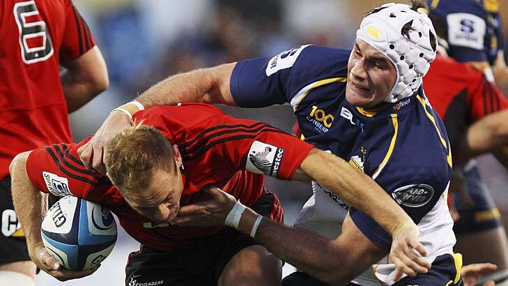 Out of hand: Andy Ellis of the Crusaders evades Ben Mowen of the Brumbies. Photo: Getty Images