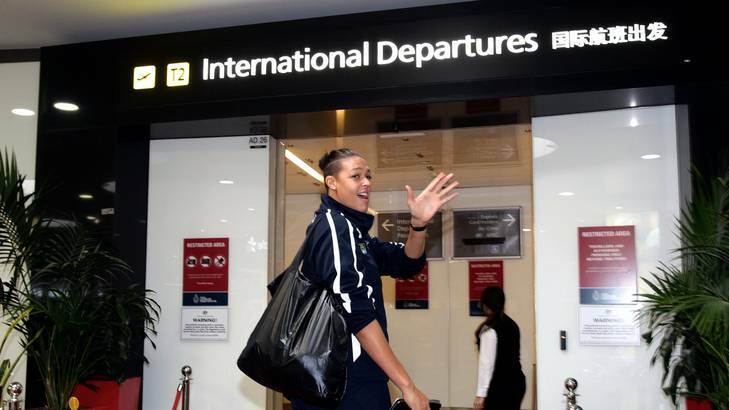 The Australian women's basketball team, the Opals leave Tullamarine airport for the London Olympics. Photo: Angela Wylie
