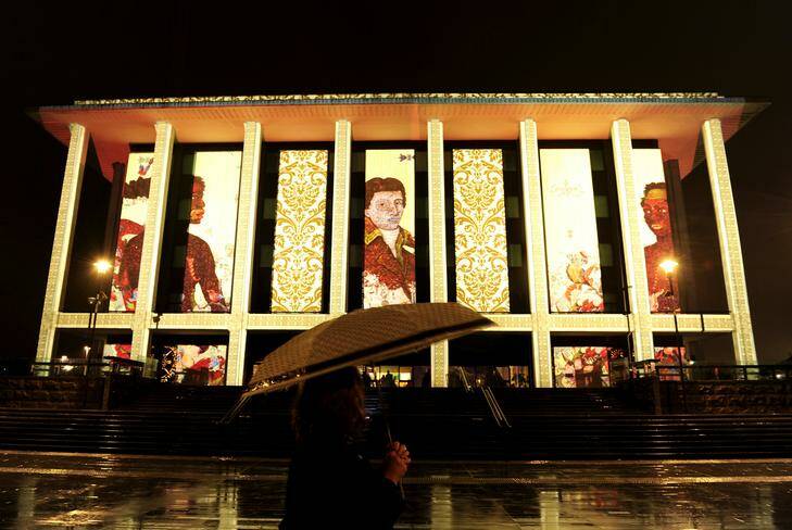 The National Library of Australia is illuminated for the Enlighten Festival. The artist who created the projection was Paul Summerfield. Photo: Stuart Walmsley