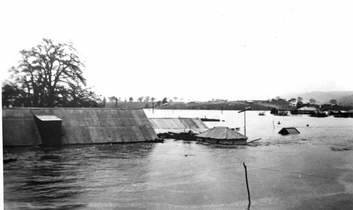 DISASTER: The 1922 flood after the river broke its banks. The roof of the Elmsall Inn can be seen just above the water level. Photo: Queanbeyan and District Historical Museum Society