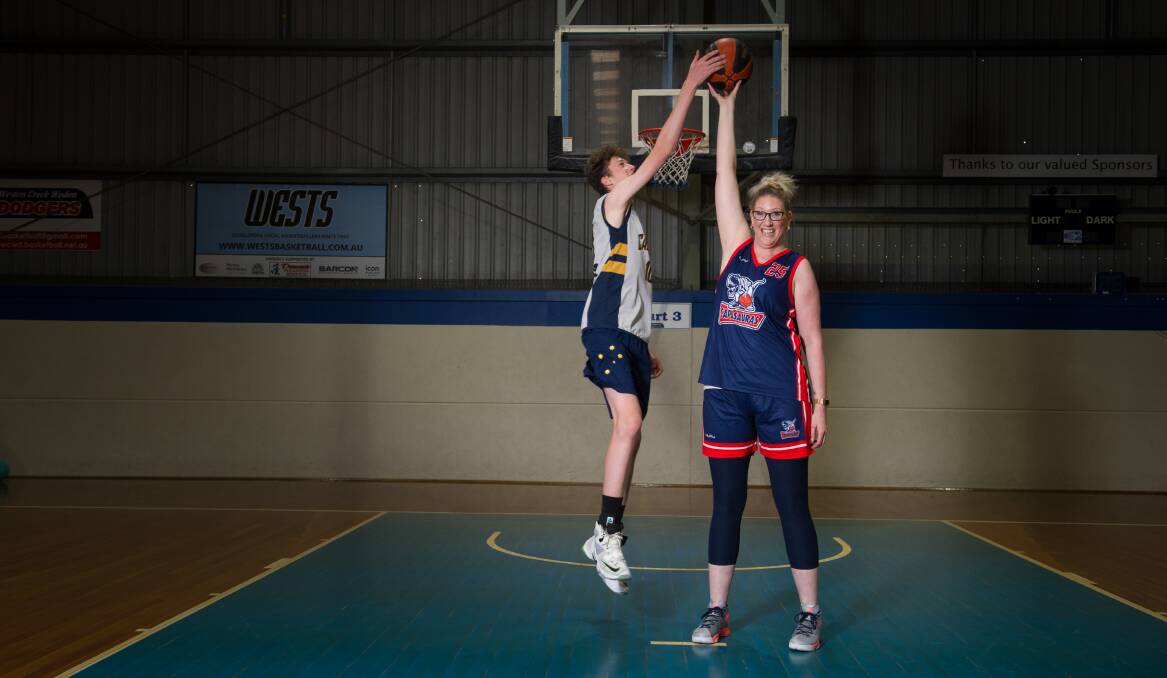 Former Canberra Capitals player Tracey Peacock stands at 202cm tall, and she is already matched by her 14-year-old son Bowyn Beatty.  Photo: Elesa Kurtz