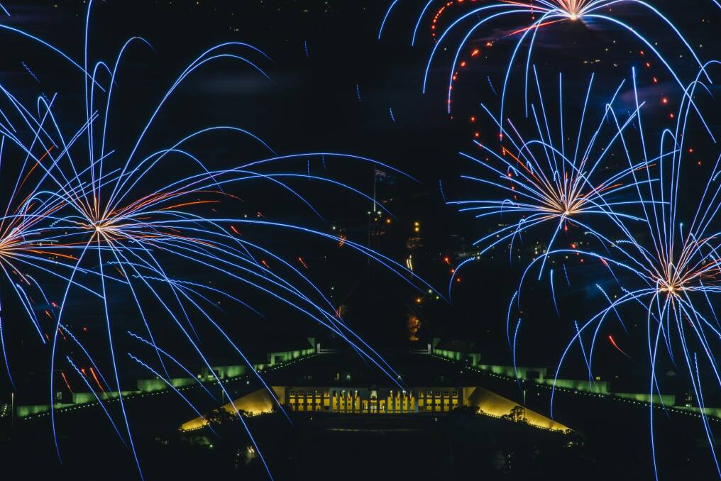 Fireworks frame Parliament House. Photo: Rohan Thomson