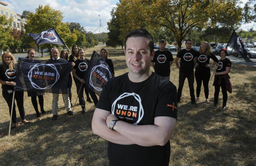 Alex White with some of the volunteers ready to go on the doorknocking "pledge" campaign he says will determine the result of the ACT election. Photo: Graham Tidy