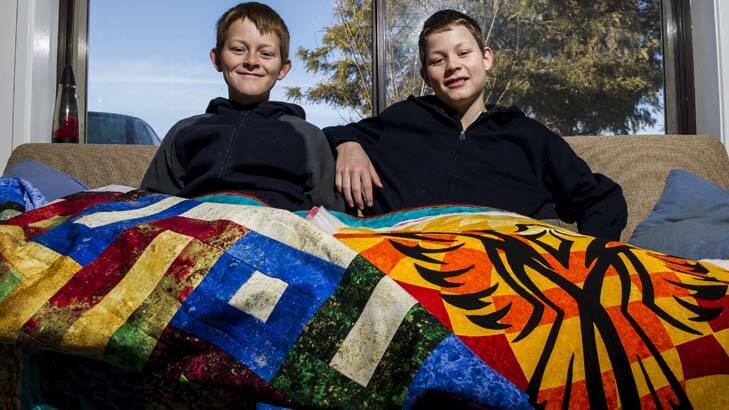 Brothers in darns ... William Bielenberg, 11, and his brother Jonathan, 13, made their own quilts. Photo: Rohan Thomson