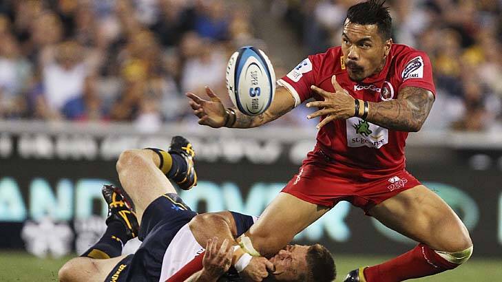 Digby Ioane of the Reds is tackled by Clyde Rathbone of the Brumbies. Photo: Getty Images