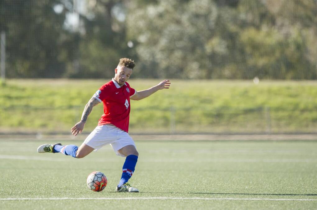 Canberra FC's Thomas James kicks the ball. Photo: Jay Cronan