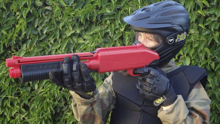 A child dressed up to play MiniBall with a modified gun. Photo: Delta Force Paintball