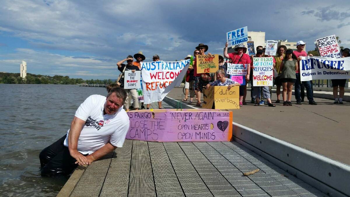 Protesters in Canberra launching cardboard boats in Lake Burley Griffin calling for an end to offshore processing in Manus Island and Nauru. Photo: Supplied