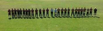 Eastlake and Weston Creek players observe a minute's silence for Ron Oakes.